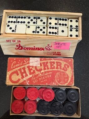 Vintage checkers and dominoes game pieces
